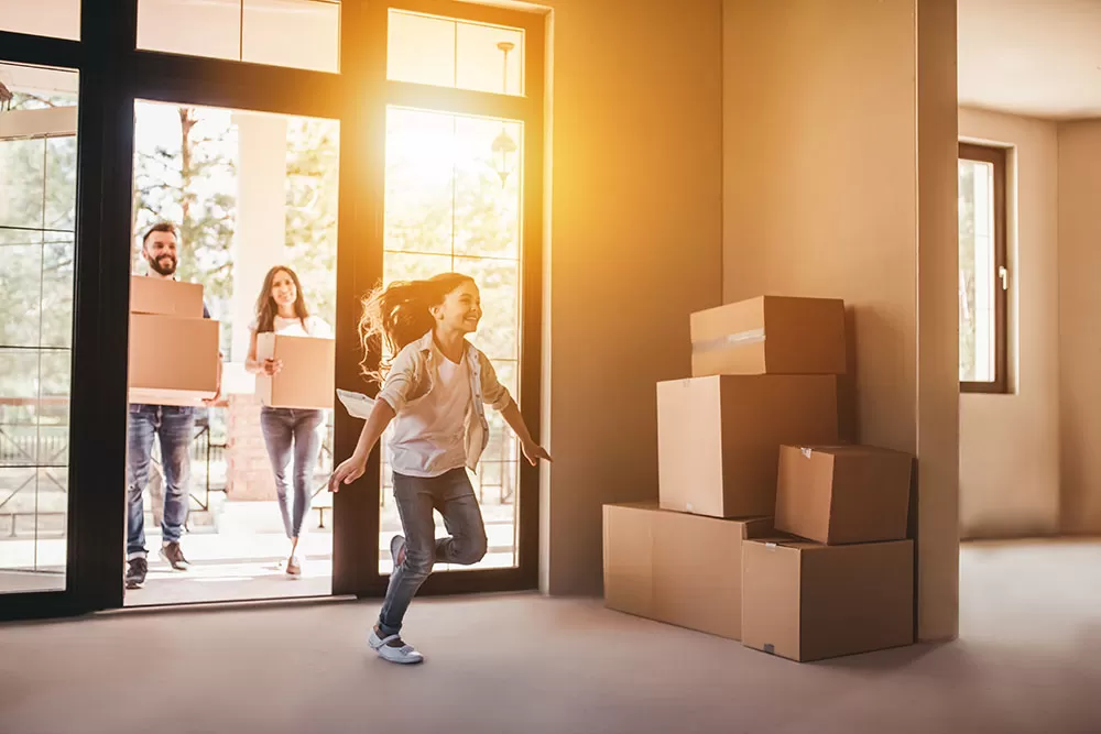 happy family moving in to a home